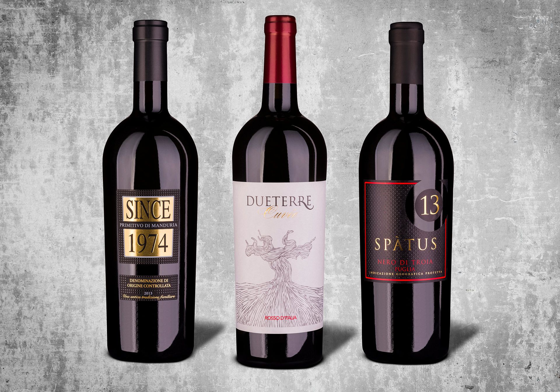 Produktaufnahmen von drei Weinflaschen italienischer Rotweine